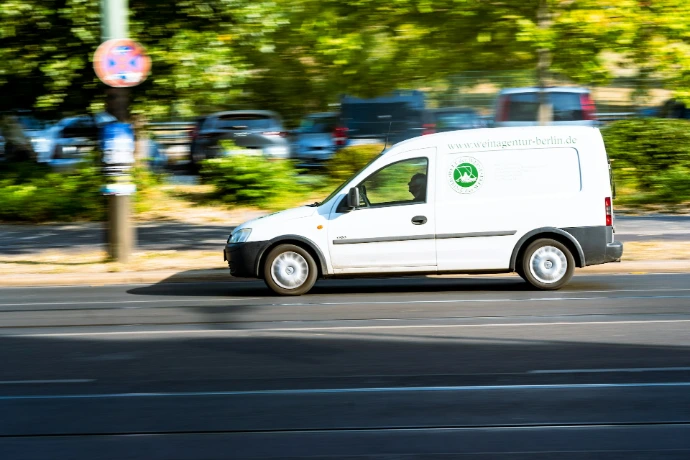 a small white car on the street